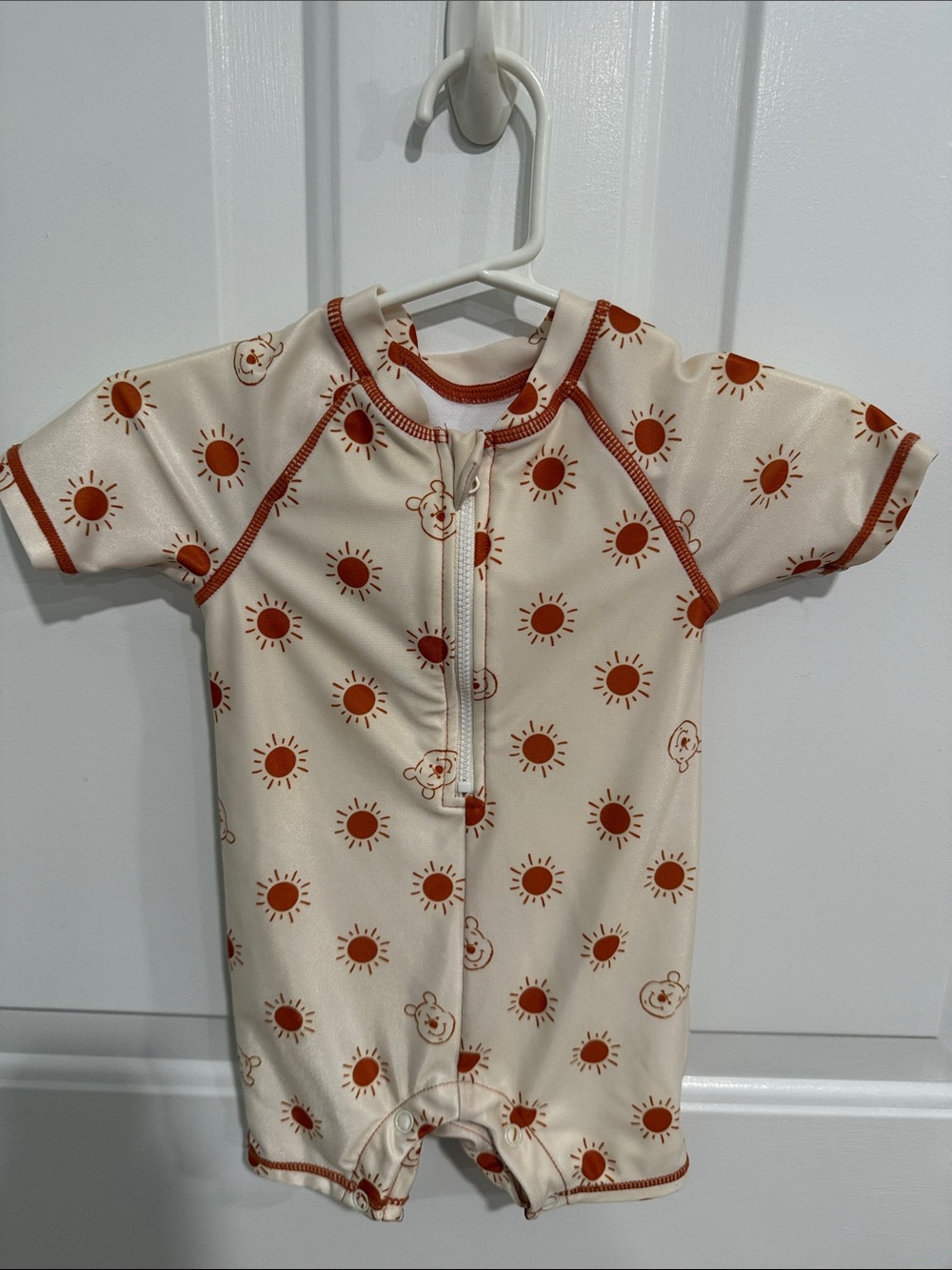 Disney Cream One-Piece Swimsuit with Rust Sun Print